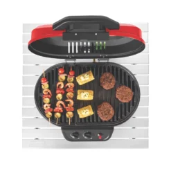 Coleman RoadTrip® 225 Portable Tabletop Propane Grill 16 Coleman RoadTrip® 225 Portable Tabletop Propane Grill -Cole Store 2000033047 coleman grills 225 TT heritage red flames turned on food on grates overhead 3
